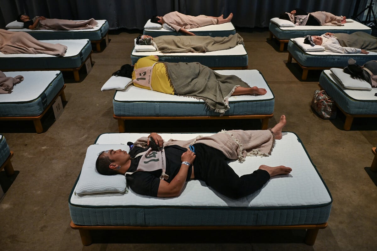 Sleep-deprived competitors caught Zzzs in a "Happy" Japanese competition