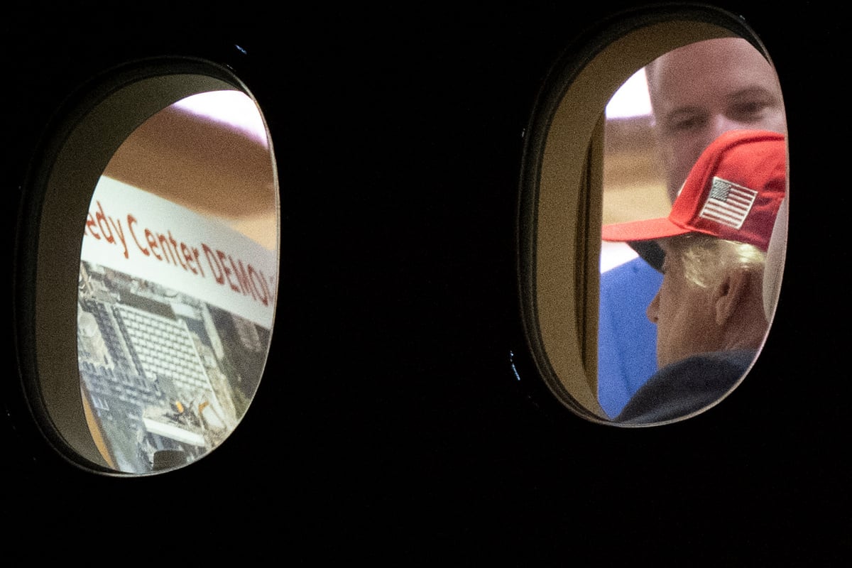 Trump caught looking at photos of Kennedy Center's apparent demolition