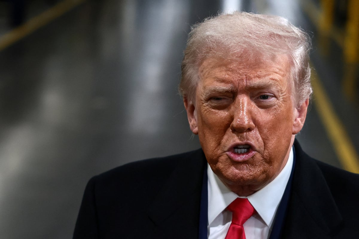 Trump flips off and curses at heckler during Ford factory visit