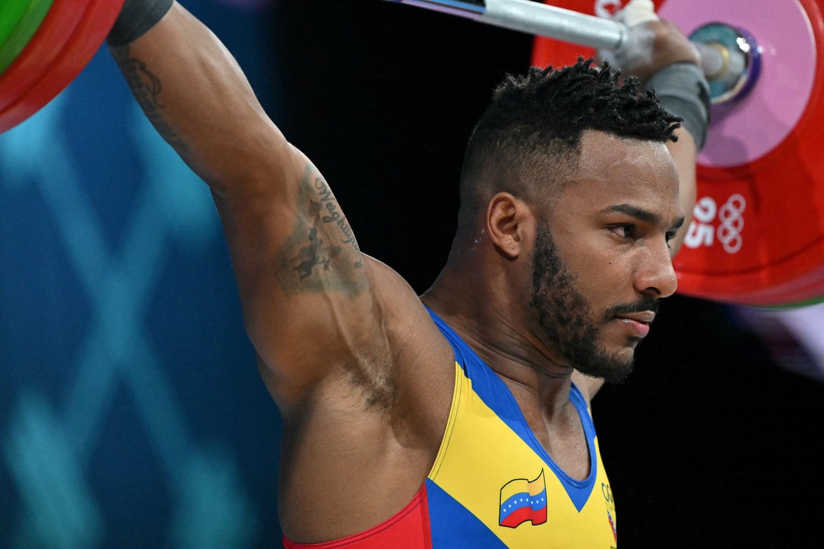 This Olympic weightlifter is utilizing his skills to help people in a stunning way
