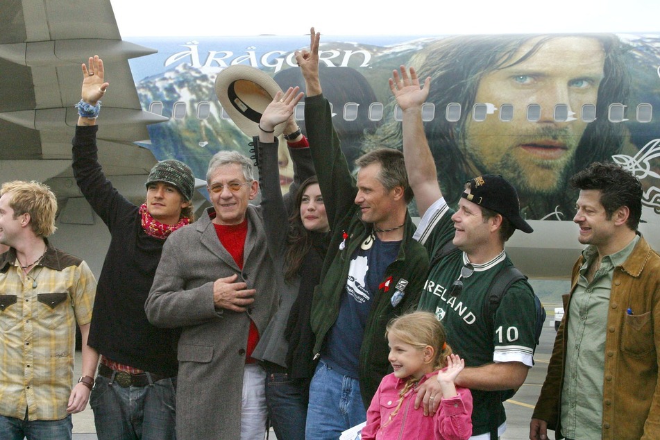 Parts of the cast of the first Lord of the Rings trilogy in 2003. It is still unclear whether other original trilogy stars will return alongside Andy Serkis (far right).