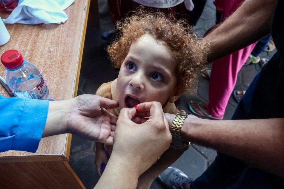 A Palestinian girl attends a polio vaccination campaign in Deir al-Balah in the central Gaza Strip on October 14, 2024.