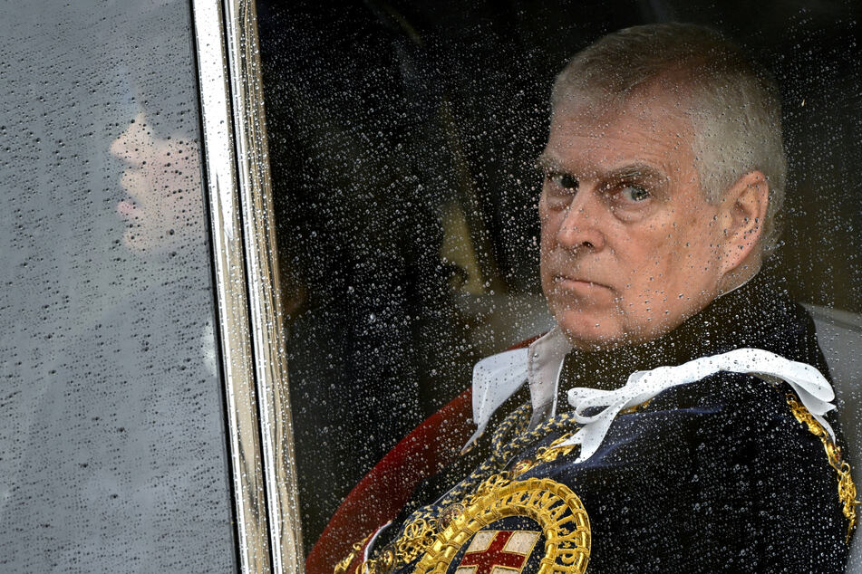 Britain's then Prince Andrew leaves Westminster Abbey in London following the coronation ceremony of King Charles and Queen Camilla on May 6, 2023.