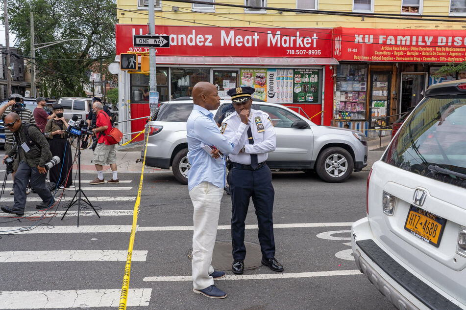 Chief of Department Rodney Harrison (r.) speaks with New York City mayoral Democratic nominee and Brooklyn Borough President Eric Adams.