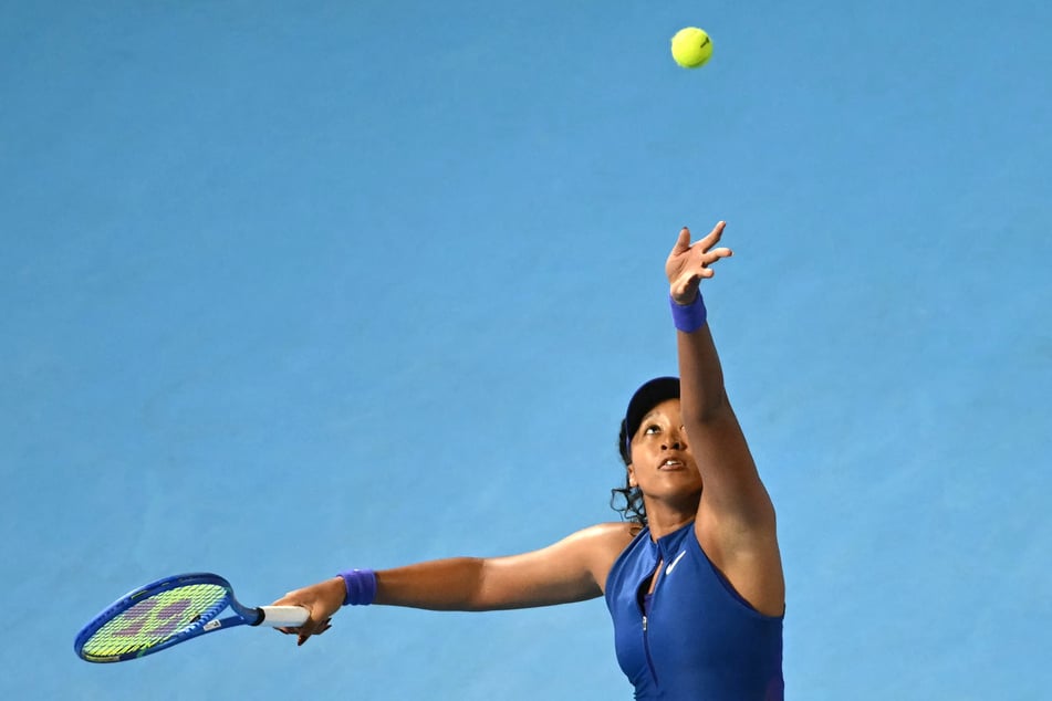 Japan's Naomi Osaka serves to Italy's Jasmine Paolini (not pictured) during the WTA Pan Pacific Open tennis tournament at Ariake Coliseum in Tokyo on October 27, 2026.