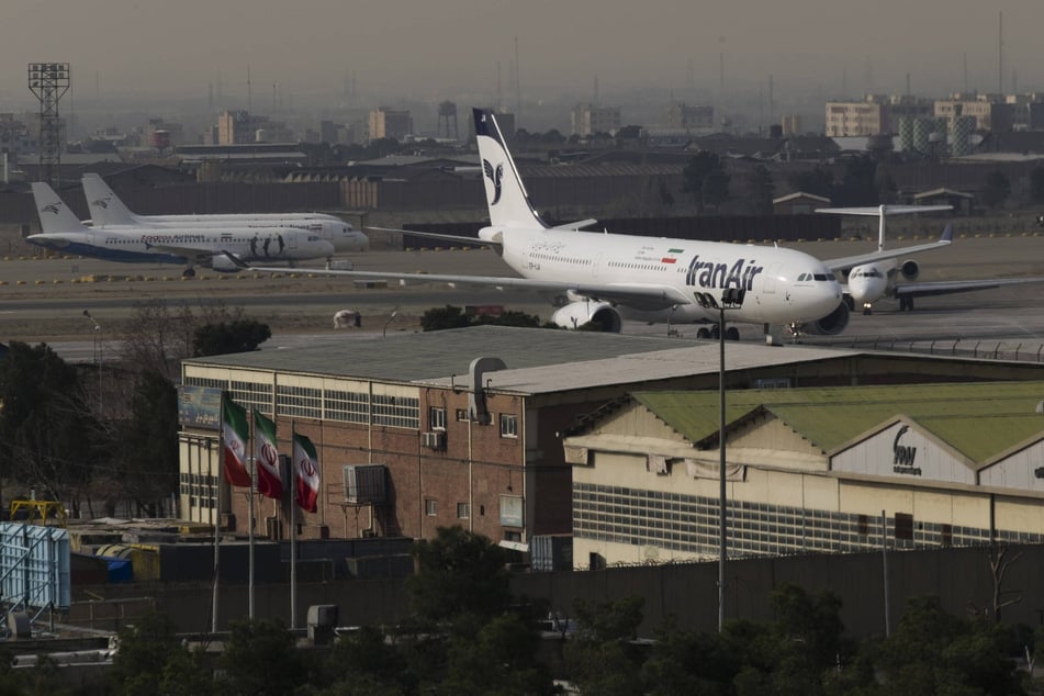 An IranAir Airbus A330 sits at Tehran's Mehrabad International Airport. Newly introduced US sanctions are set to trigger chaos in Iran's aviation sector.