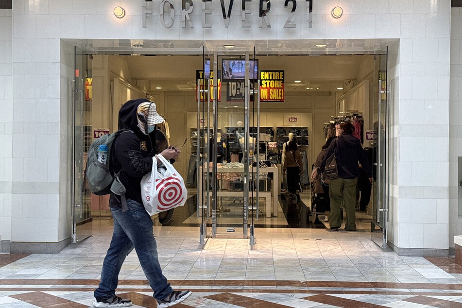 A pedestrian walks by a Forever 21 store that is preparing to close on February 20, 2025 in San Francisco, California.