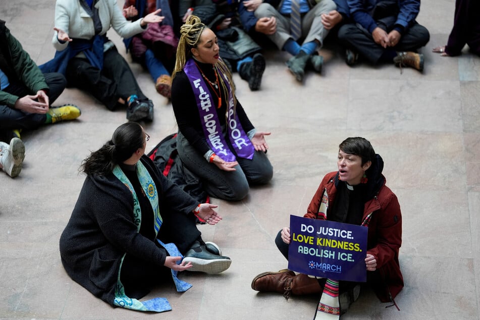 Faith in Action activists take part in a protest in opposition to proposed DHS funding legislation on Capitol Hill on January 29, 2026.