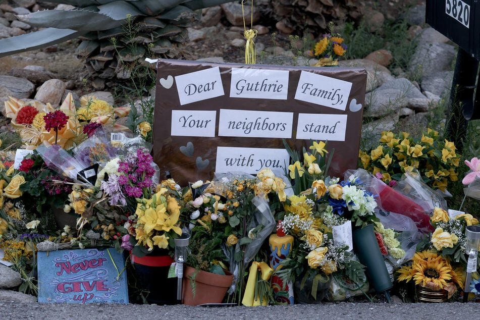 A memorial is seen in front of Nancy Guthrie's residence in Tucson, Arizona, on February 26, 2026.