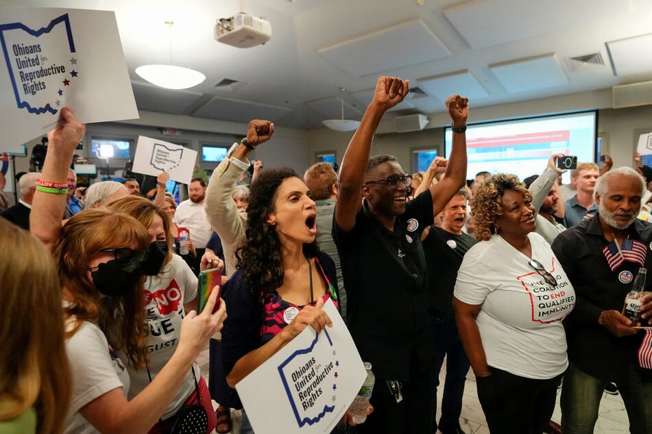 Ohioans celebrate the defeat of Issue 1, a Republican-backed measure that would have made it harder to amend the state constitution, an initiative aimed at helping defeat a November referendum to protect abortion access.