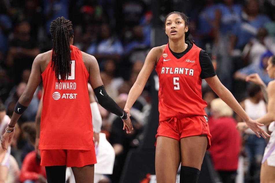 Angel Reese (r.) and Rhyne Howard of the Atlanta Dream high five during Game 6 of the 2026 WNBA Finals. The winner between the Dream and the Golden State Valkyries will be decided in Game 7. 