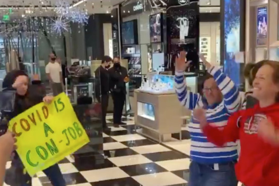 The anti-maskers screamed "no masks" and danced to a Trump-inspired version of YMCA.