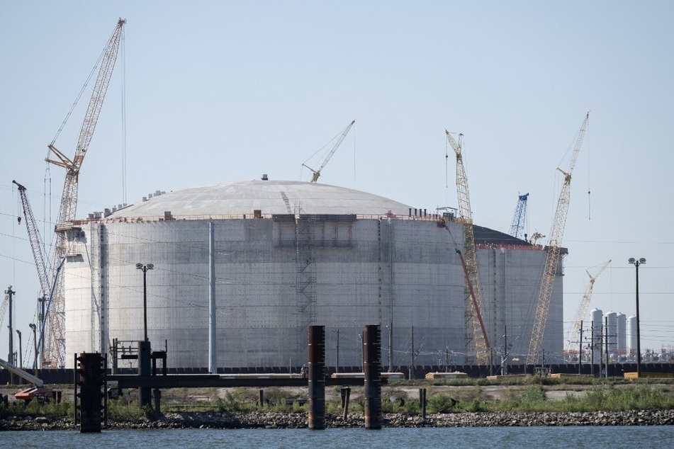 Construction cranes are seen near the site of the Venture Global LNG plant next to the Mississippi river in Plaquemines Parish, south of New Orleans, Louisiana.