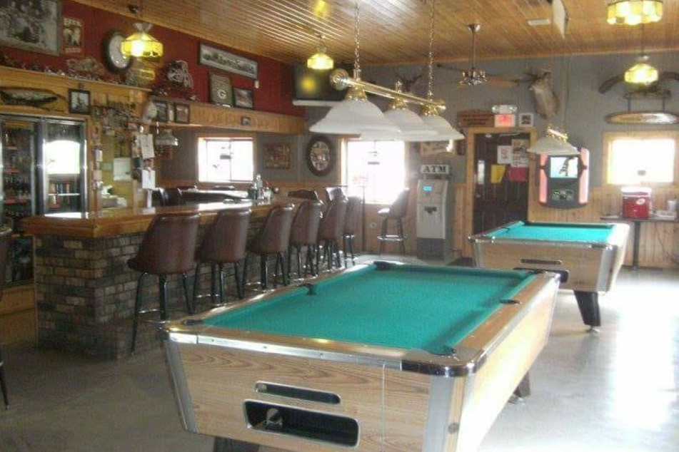 Security footage shows man attempting to spike bartender's drink in Wisconsin bar