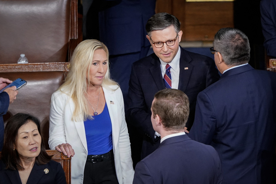 Representative Marjorie Taylor Greene (l.) and House Speaker Mike Johnson (center r.) arriving to a joint meeting of Congress in Washington, DC, April 11, 2024.