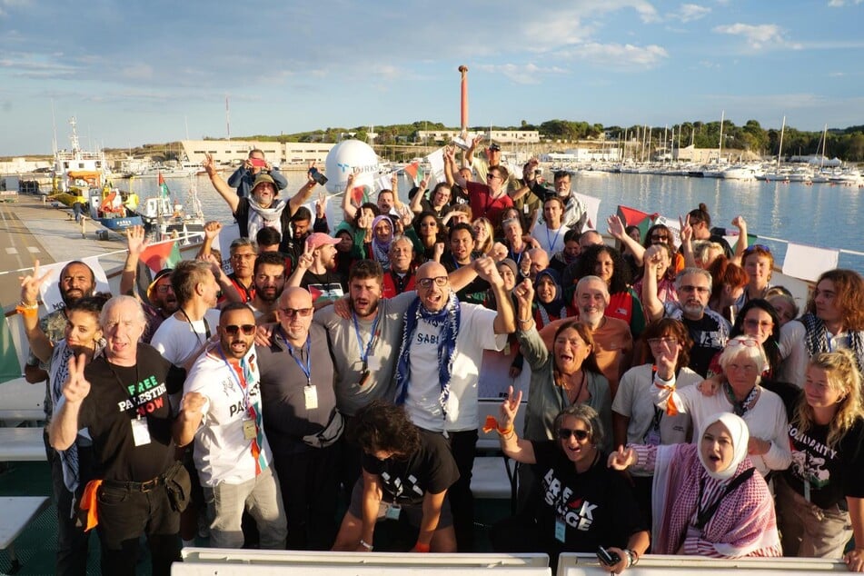 Participants are pictured aboard the Conscience before departing on their mission to deliver life-saving aid to Gaza.