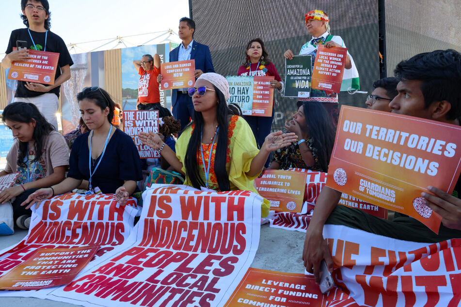 Climate activists and indigenous community members take part in a protest at the Sharm el-Sheikh International Convention Center during the COP27 UN climate conference.