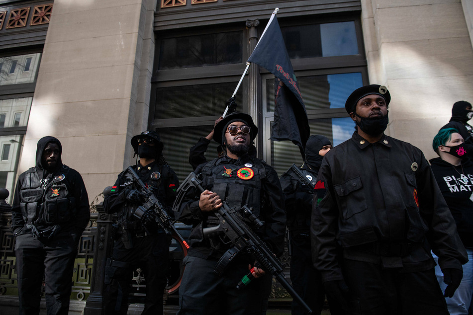 Members of the New Black Panther Party joined the protest.