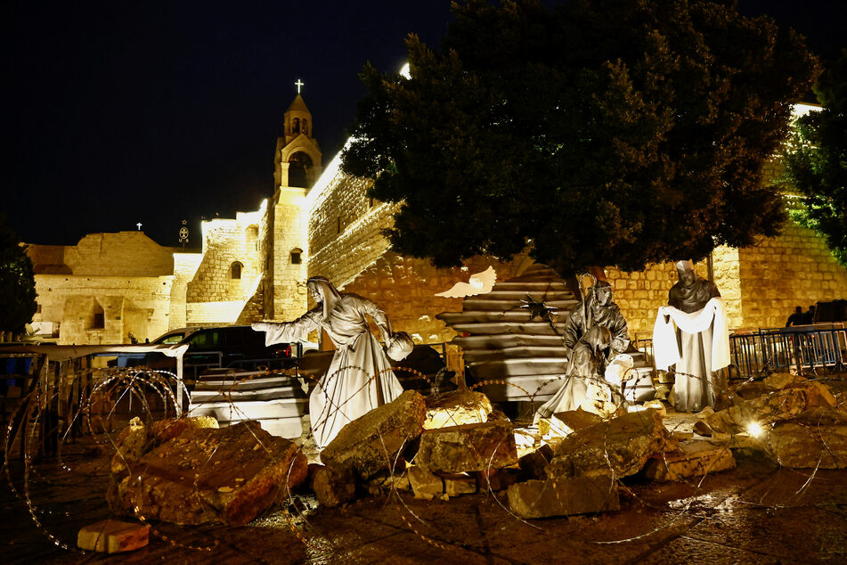 Christmas celebrations in the occupied West Bank city of Bethlehem were scrapped, as Palestinians showed their solidarity with the people of Gaza with a nativity installation.