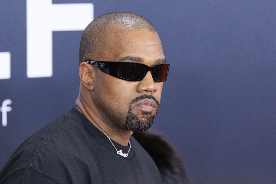 Kanye West reportedly (pictured) doesn't mind Lewis Hamilton spending time with his children and ex-wife.