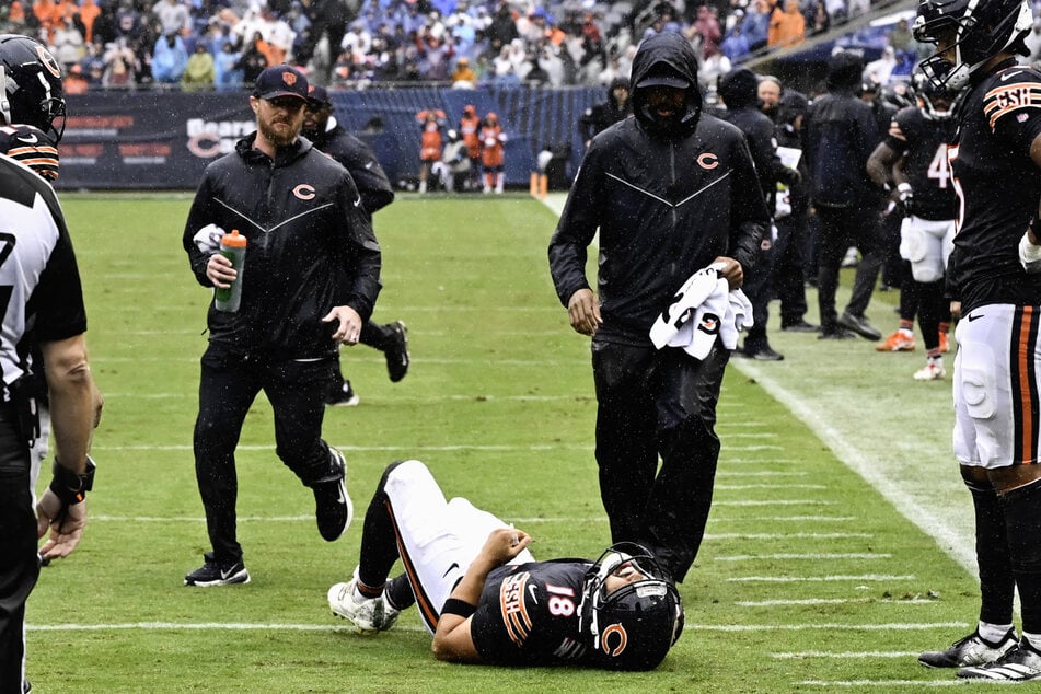 Chicago Bears quarterback Caleb Williams lies on the field with an apparent injury against the Minnesota Vikings during the second half at Soldier Field.