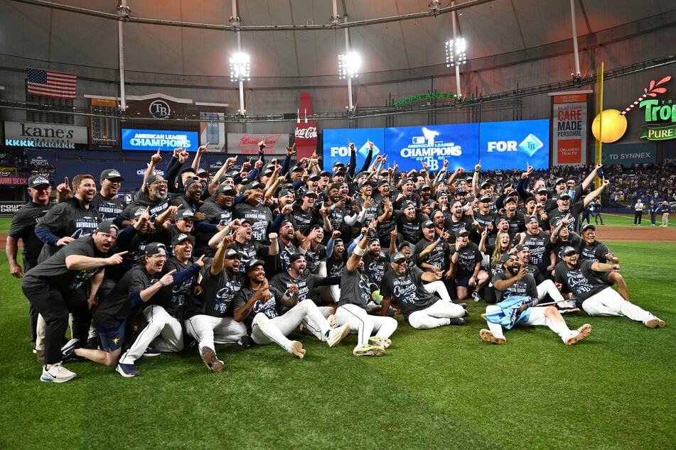 The Tampa Bay Rays celebrate on the field after defeating the Cleveland Guardians in game six of the American League Championship Series.