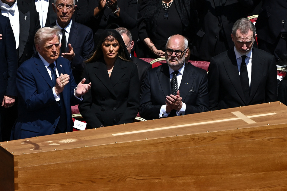 President Donald Trump (l.) and first lady Melania Trump (second from l.) attend the funeral mass of Pope Francis in St. Peter's Square at the Vatican on April 26, 2025.