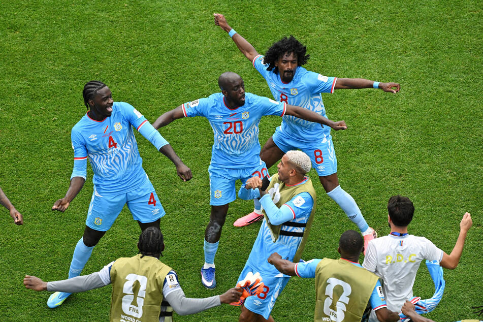 DR Congo's Yoane Wissa celebrates with teammates after scoring against Portugal.