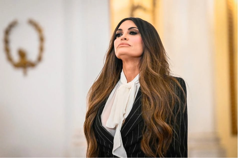 US Ambassador Kimberly Guilfoyle arrives at the Greek Presidential Palace to present her credentials in Athens on November 4, 2025. In an X post shared on Tuesday, she announced her resignation amid a bribery scandal.