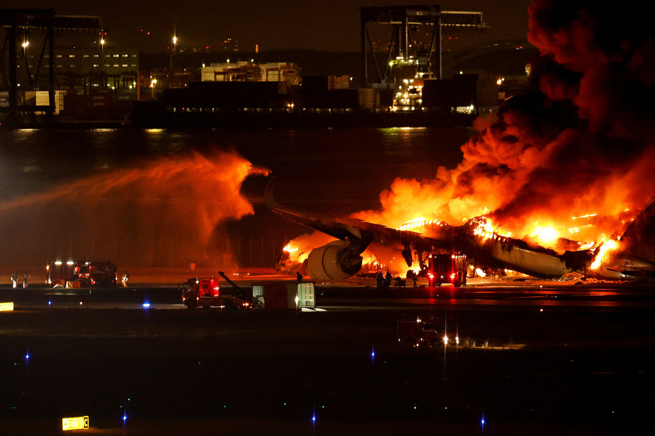 Japan Airlines plane catches fire on Tokyo airport runway after deadly crash