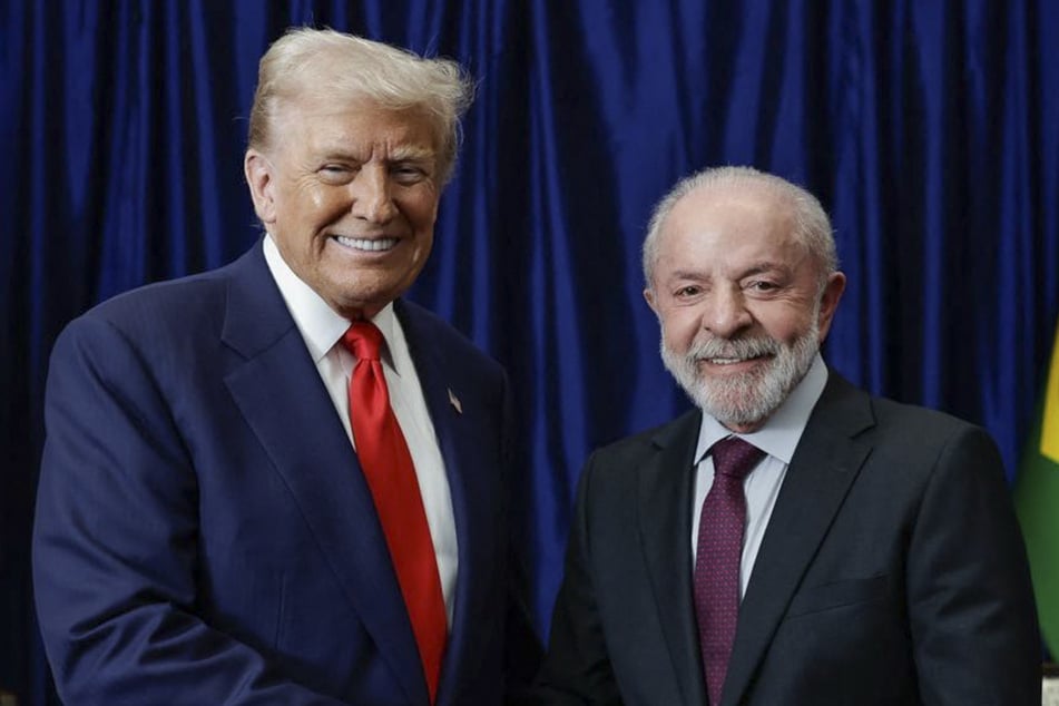 Brazil's President Luiz Inacio Lula da Silva (r.) shakes hands with US President Donald Trump during a bilateral meeting on the sidelines of the ASEAN Summit in Kuala Lumpur on October 26, 2025. The two leaders have had a rocky relationship over the years.