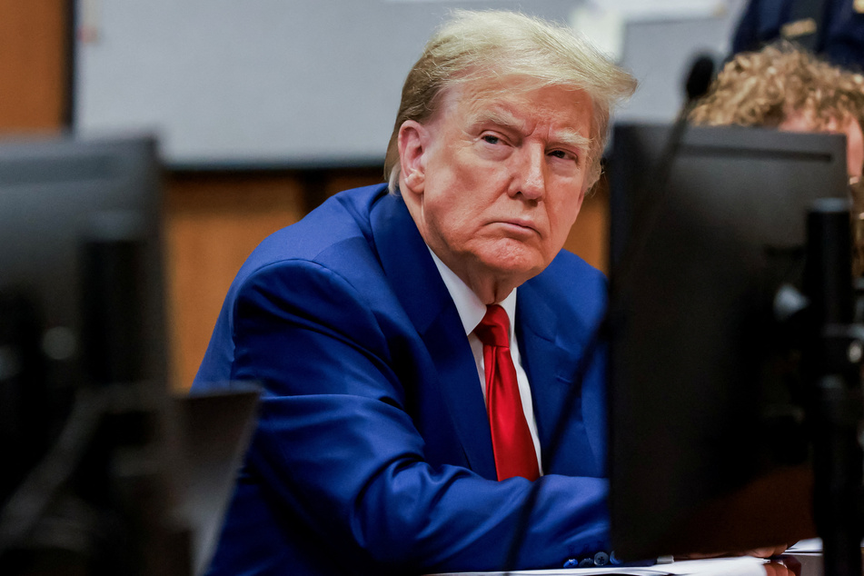 Donald Trump sits in the Manhattan courtroom at a hearing in his criminal case on charges stemming from hush money paid to a porn star.