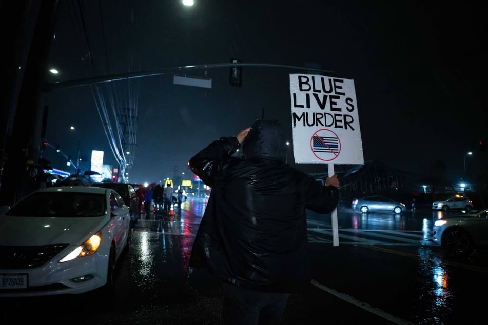 A protester takes to the streets demanding accountability in the killing of Keenan Anderson, who died while in LAPD custody on January 3, 2023.