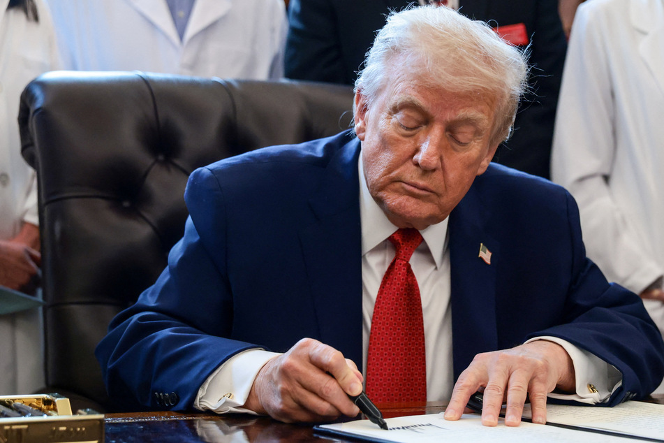 Trump quietly signs massive military spending bill that bucks hostile position on Europe