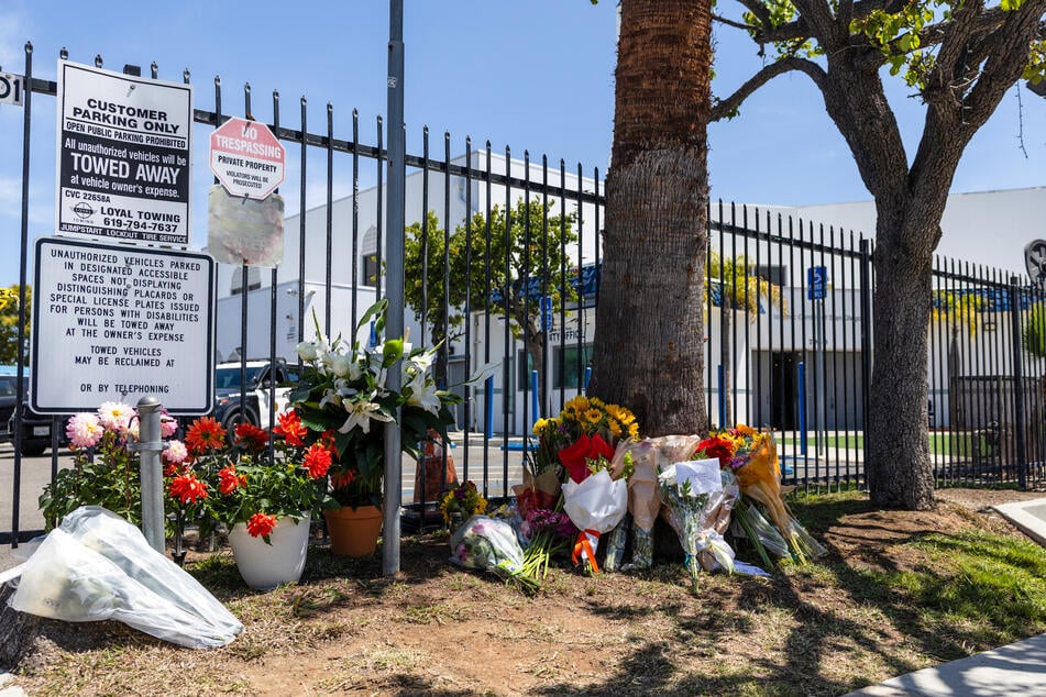 Flowers placed by local residents are seen a day after a shooting at the Islamic Center of San Diego in California, on May 19, 2026.
