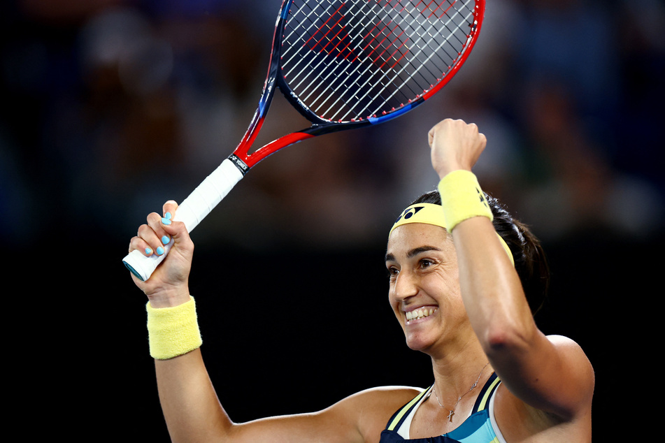 France's Caroline Garcia celebrates winning her first round match against Japan's Naomi Osaka.