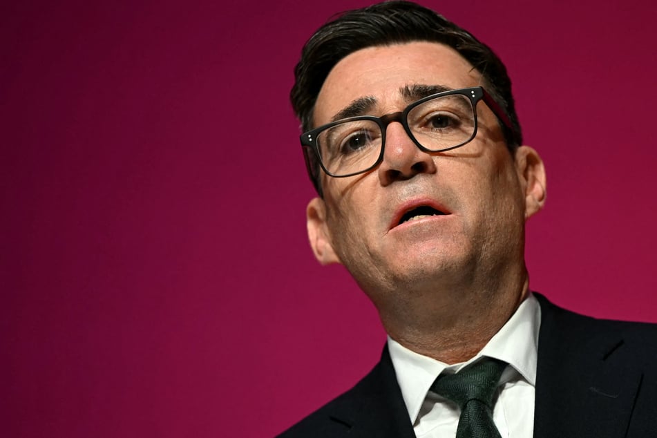 Britain's Prime Minister Andy Burnham sings The Red Flag on the final day of the annual Labour Party conference on Wednesday. The UK leader says there are "strong indications" that Iran was involved in the recent airbase security scare.