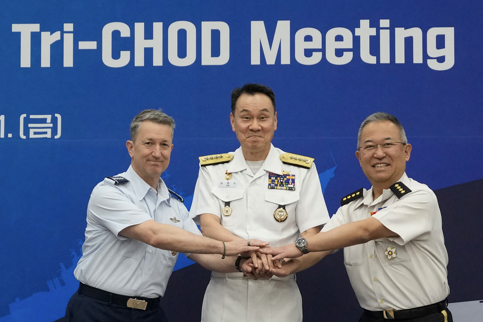 From l. to r.: US Chairman of the Joint Chiefs of Staff Air Force Gen. Dan Caine, South Korea's Admiral Kim Myung-soo, and Japan's General Yoshihide Yoshida pose during the Trilateral Chiefs of Defense meeting at the Defense Ministry in Seoul on July 11, 2025.