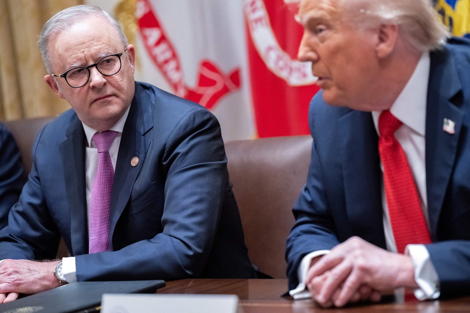President Donald Trump (r.) speaks with Australia's Prime Minister Anthony Albanese in the Cabinet Room of the White House on October 20, 2025.