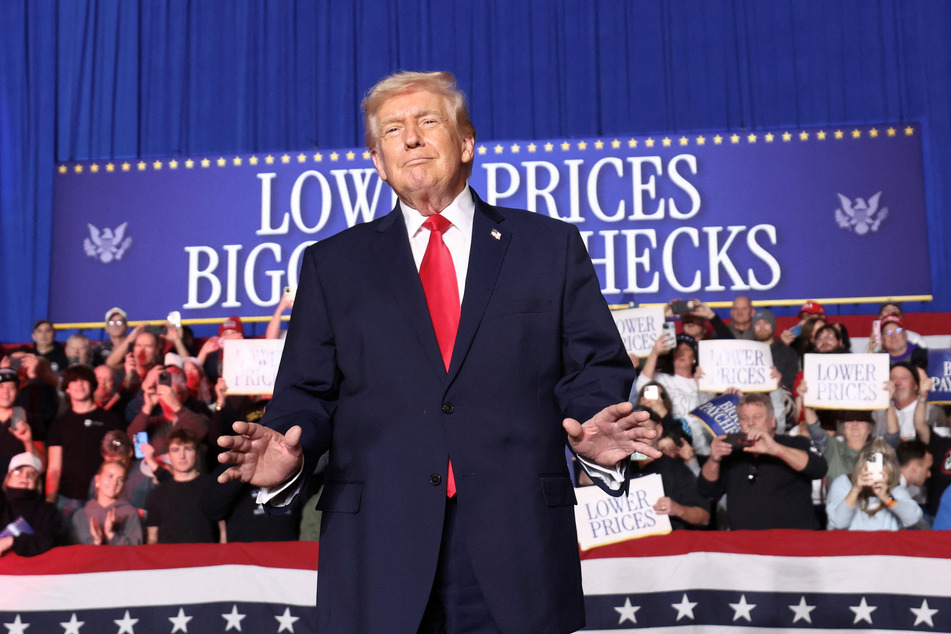 President Donald Trump gestures to the crowd in Clive, Iowa, on January 27, 2026.