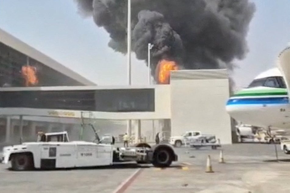 Smoke and flames rise from King Khalid Airport, after Yemen's Houthis said they attacked the airport, in Riyadh, Saudi Arabia.