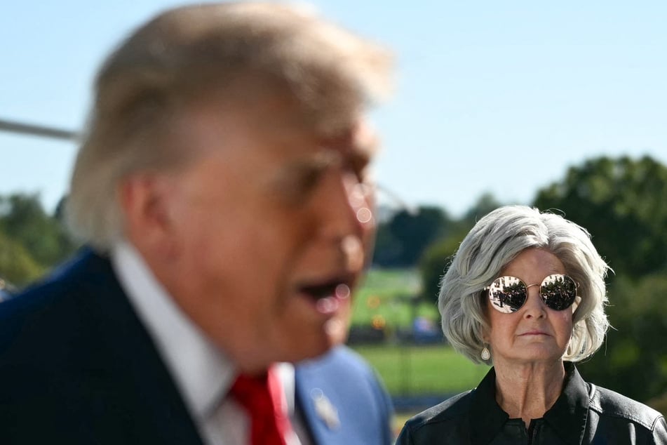 White House Chief of Staff Susie Wiles (r.) looks on as President Donald Trump speaks to the press on the South Lawn of the White House in Washington DC on October 6. Trump recently shut down rumors that he was seeking to replace Wiles.