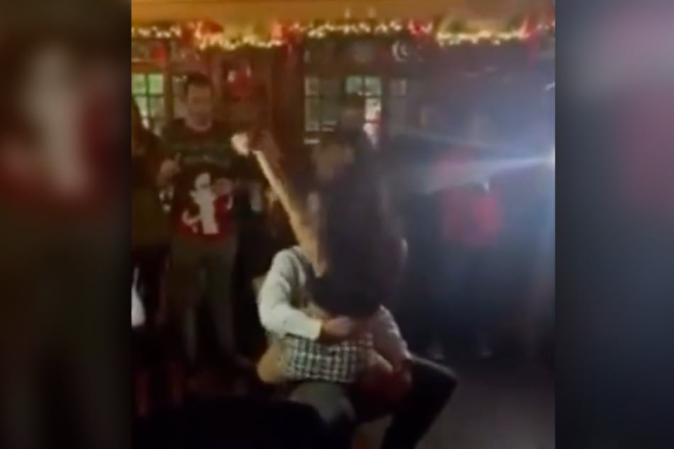 Nick McGarry and a female police officer got naughty at the annual precinct Christmas party.