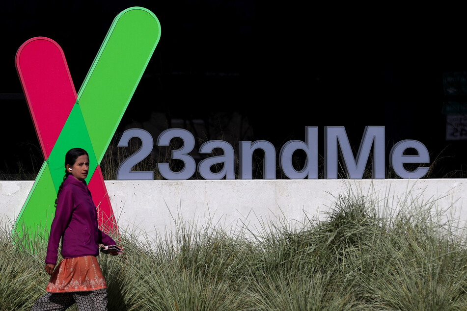 A pedestrian walks by a sign posted in front of the 23andMe headquarters on February 1, 2024 in Sunnyvale, California.