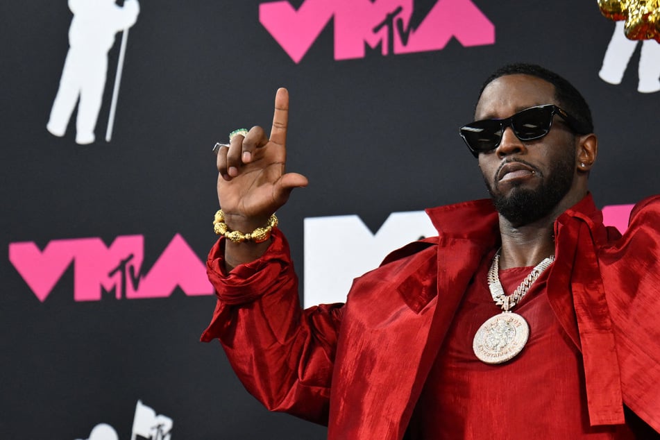 Sean "Diddy" Combs poses with the Global Icon award in the press room during the MTV Video Music Awards in Newark, New Jersey, on September 12, 2023. The disgraced rapper has been moved to a smaller prison as he serves a sentence for prostitution-related charges.