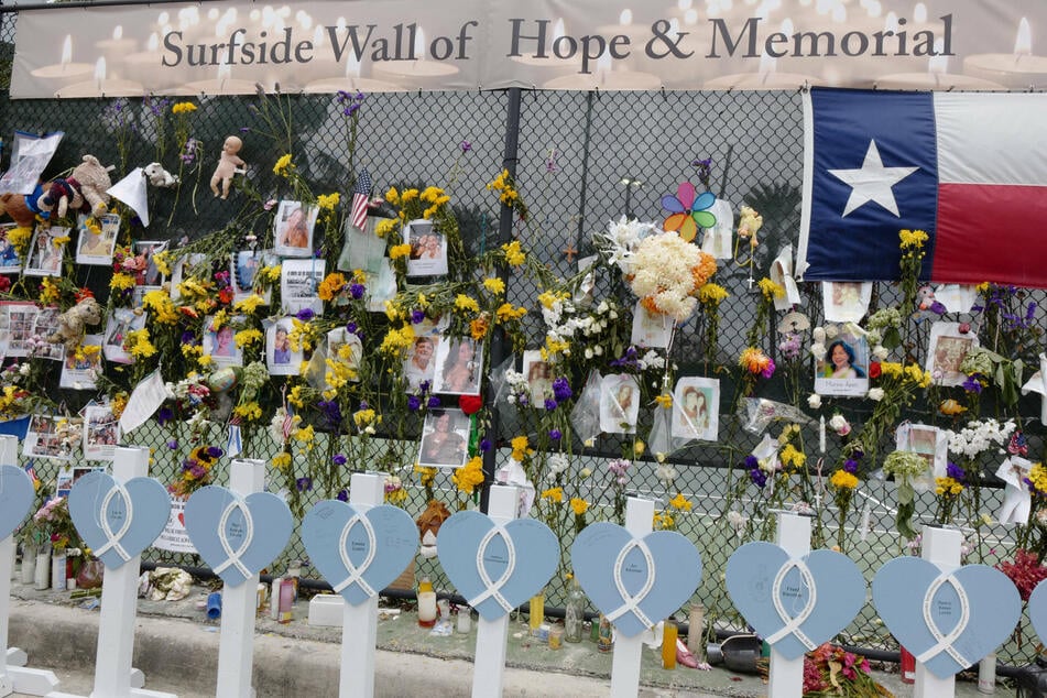Surfside condo collapse death toll jumps to 60 as effort shifts to "devastating" recovery phase