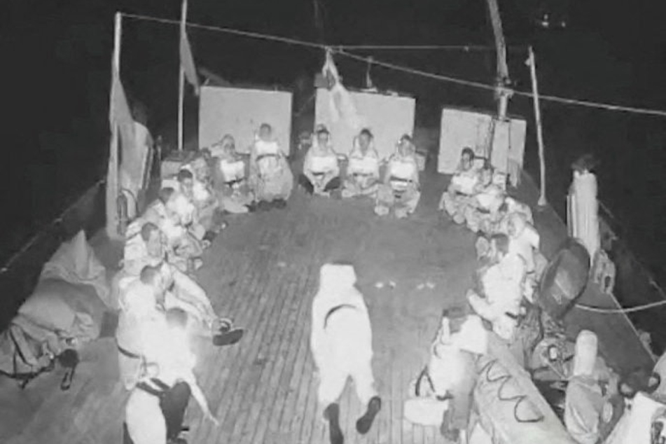 Crew members onboard a vessel sailing as part of the Global Sumud Flotilla prepare to be illegally boarded by Israeli forces.