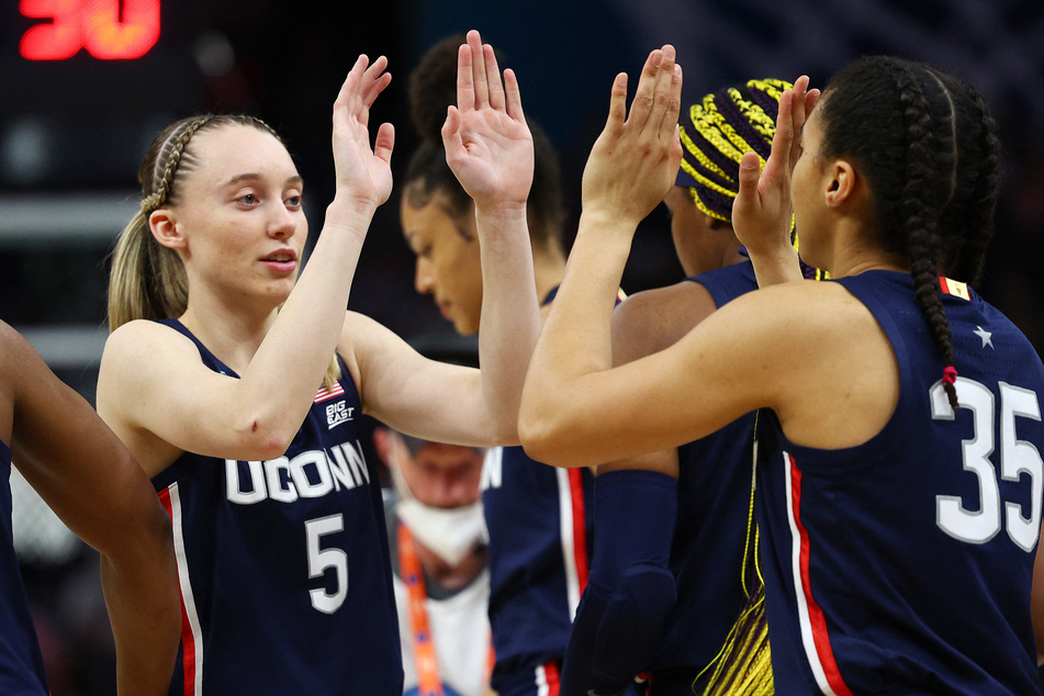 College basketball fans are eager for Paige Bueckers' (l) return to the basketball court come November.