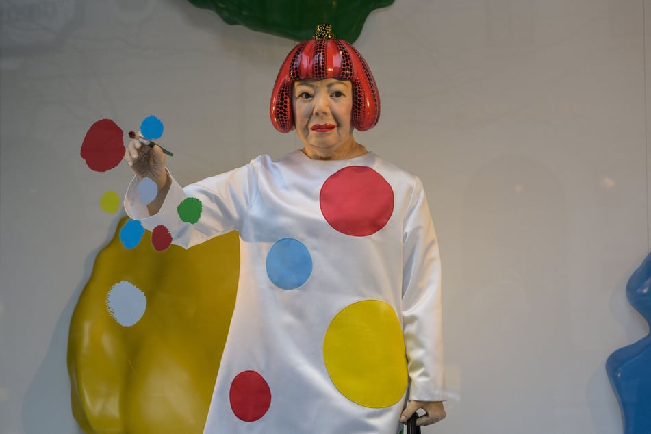 ANGELA WEISS / AFPPhoto by ANGELA WEISS / AFP A life-like robot of artist Yayoi Kusama paining a window stands at the Louis Vuitton store on Fifth Avenue in New York City on January 13, 2023