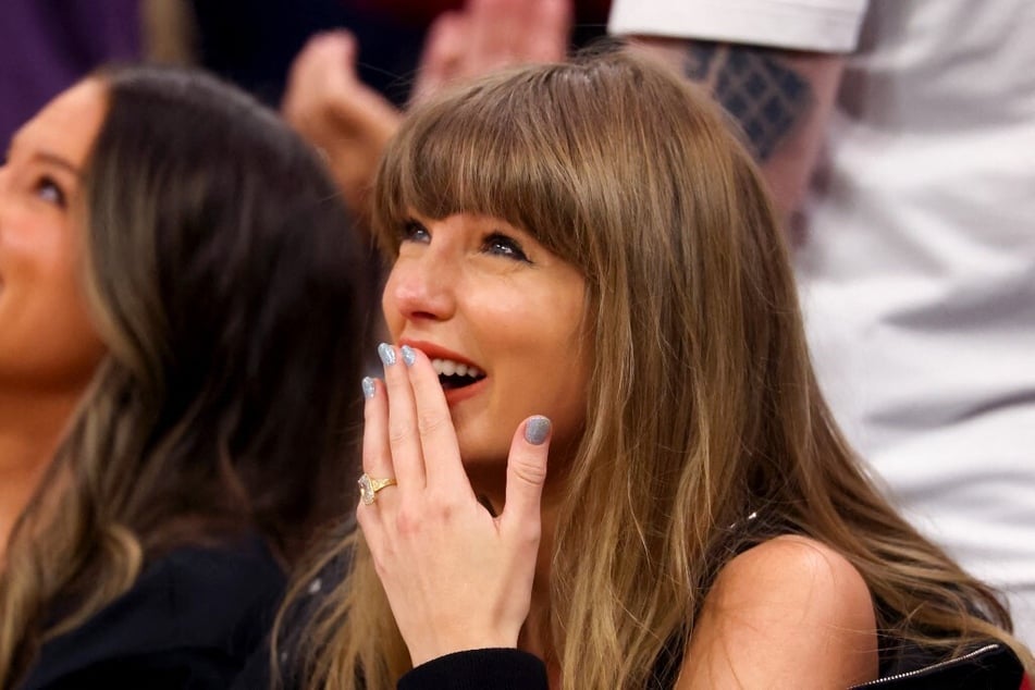 Taylor Swift joins Travis Kelce at Game Three between the New York Knicks and the Cleveland Cavaliers at Rocket Arena on May 23, 2026 in Cleveland, Ohio.